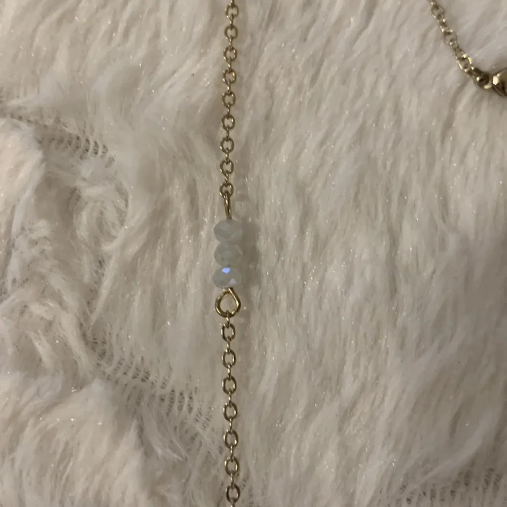 Disc‎ pendant necklace with some little beads on chain.Beautiful and sparkly.